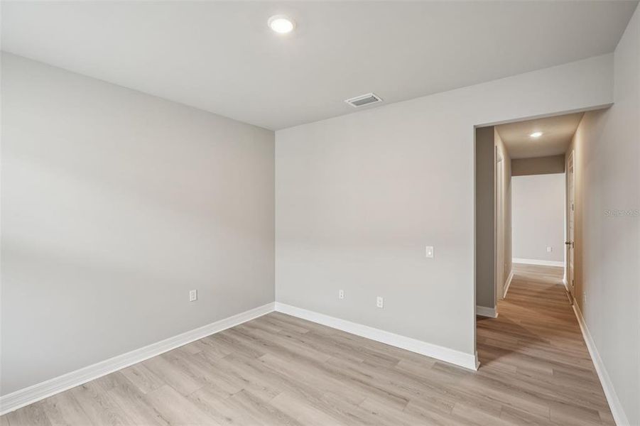 Spacious, unfurnished interior of a new home in Crescent Lakes - Signature Series, Punta Gorda (Image 24).