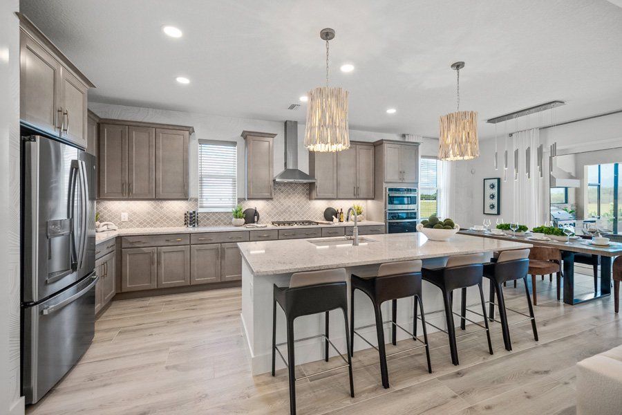 Representative furnished interior of a home built from the Halyard by Homes by Towne in Shellstone at Waterside, Sarasota (Image 7).