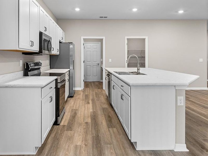 Your new kitchen features 36-inch cabinets, Samsung SS appliances, and a walk-in pantry.