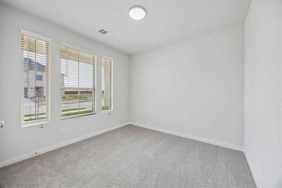 Bedroom in the Stanley II home plan by Trophy Signature Homes – REPRESENTATIVE PHOTO