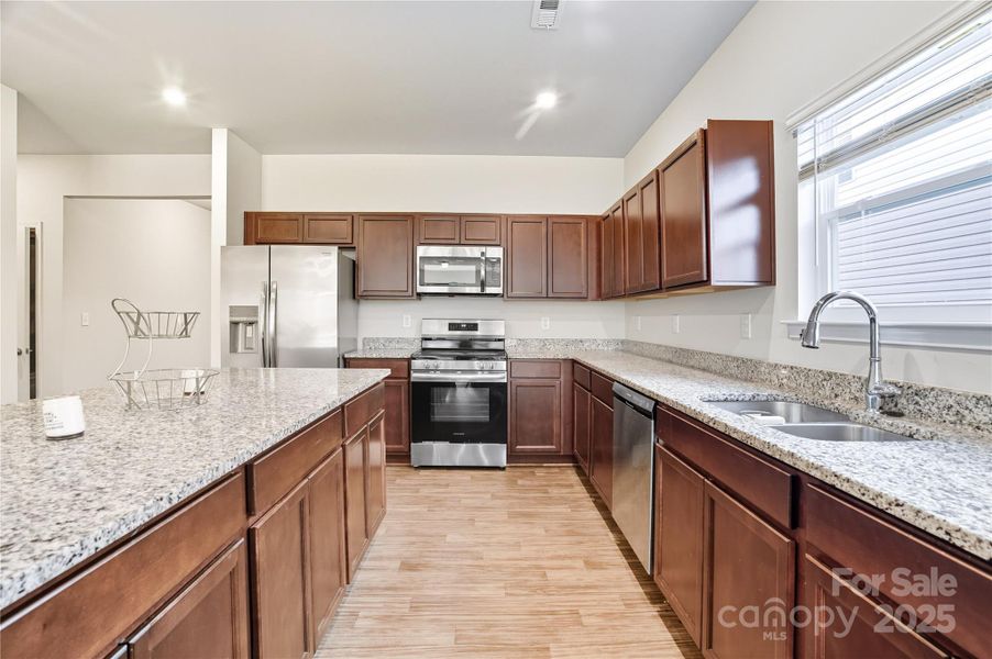 Furnished interior view inside a new home in Orchard Creek, Charlotte (Image 6).