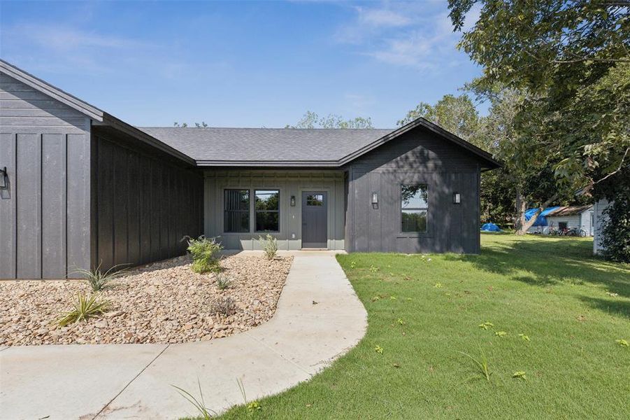 View of front of home with a front lawn