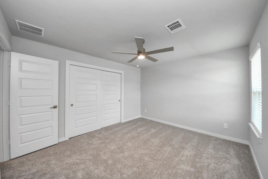 Generously sized secondary bedrooms featuring spacious closets, soft and inviting carpeting underfoot, large windows allowing plenty of natural light, and the added touch of privacy blinds for your personal retreat. Generously sized secondary bedrooms featuring spacious closets, soft and inviting carpeting underfoot, large windows allowing plenty of natural light, and the added touch of privacy blinds for your personal retreat.