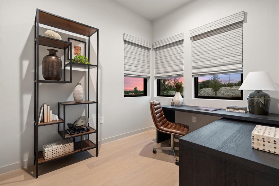 Bright and airy study with large windows and a built-in desk offers a productive and inspiring workspace. Bright and airy study with large windows and a built-in desk offers a productive and inspiring workspace.