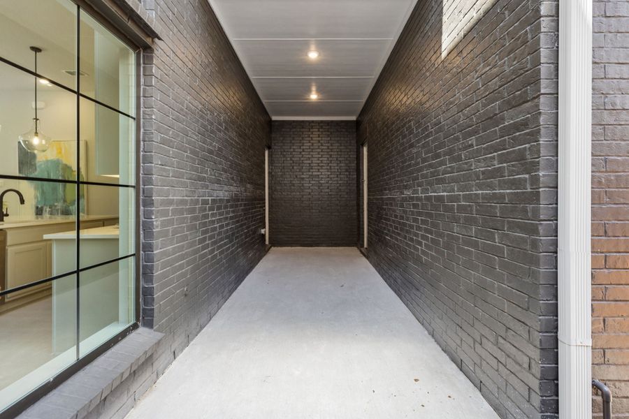 Exterior details and patio area of a home in Newman Village Townhomes, Frisco (Image 4).