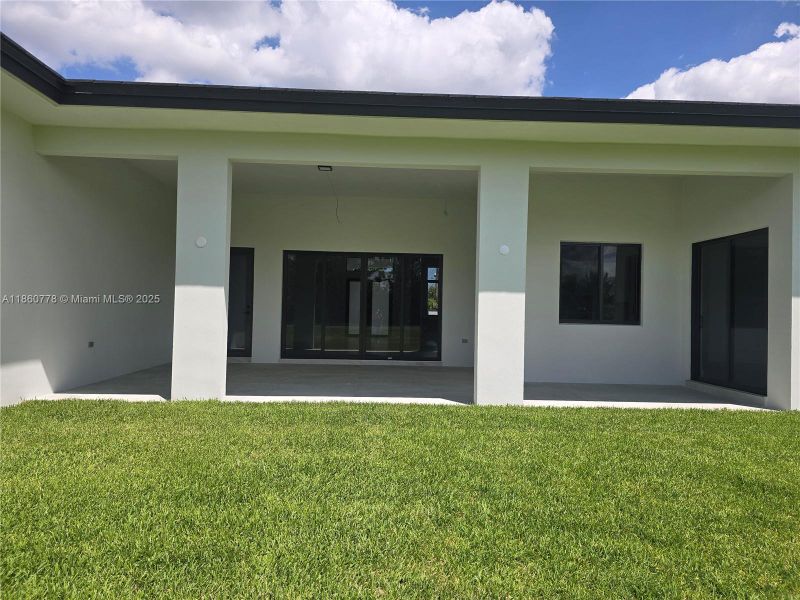 Front exterior of a new home in , Homestead, FL, highlighting curb appeal (Image 36).