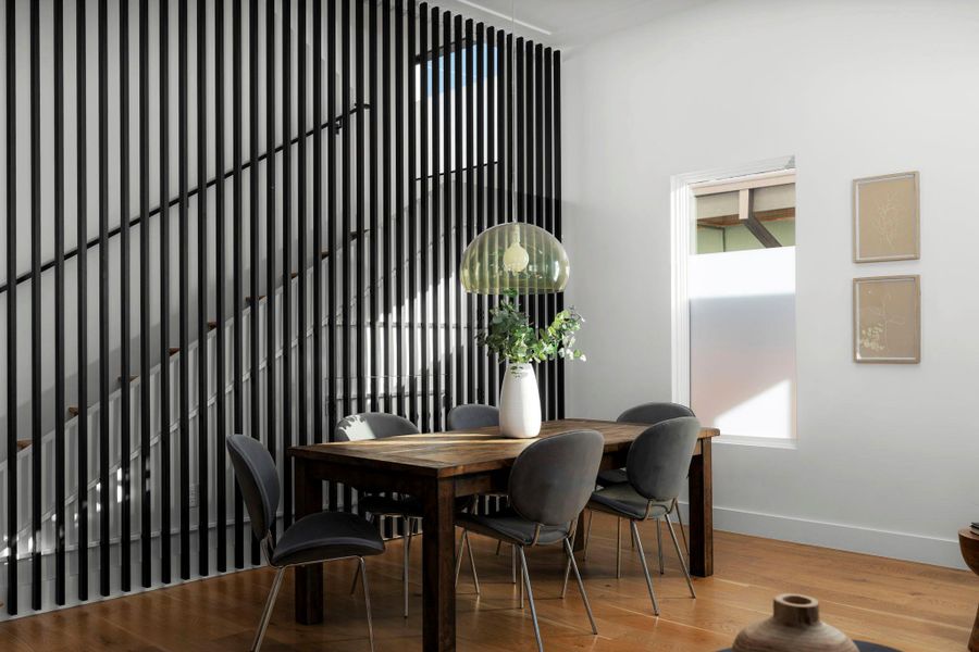 Dining room with wood finished floors and baseboards
