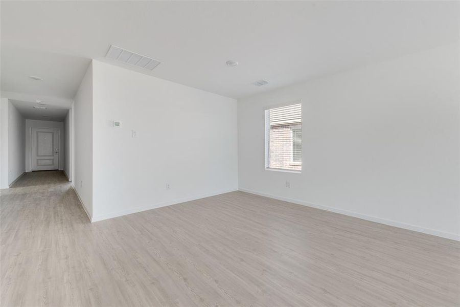 Unfurnished room with light wood-type flooring