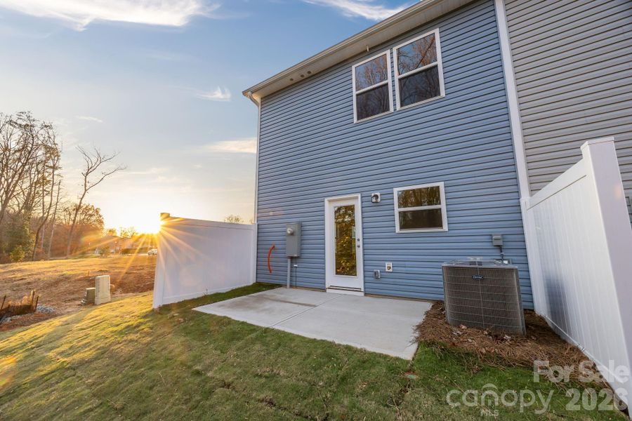 Exterior details and patio area of a home in Townes at Ribbon Walk, Charlotte (Image 3).