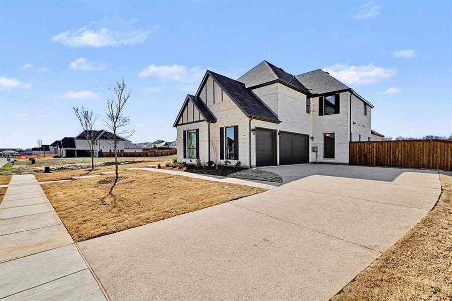 Front exterior of a new home in , Prosper, TX, highlighting curb appeal (Image 22).