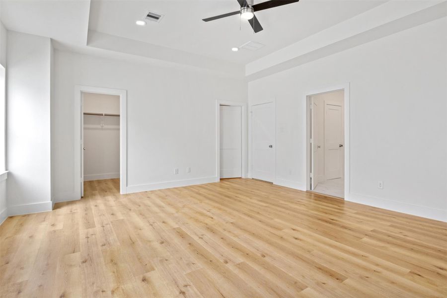 Enjoy the luxury of his-and-hers walk-in closets in the primary suite—thoughtfully designed for comfort, convenience, and a royal touch. Enjoy the luxury of his-and-hers walk-in closets in the primary suite—thoughtfully designed for comfort, convenience, and a royal touch.