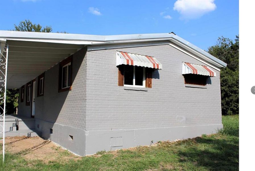 Exterior details and patio area of a home in , Whitney (Image 9).