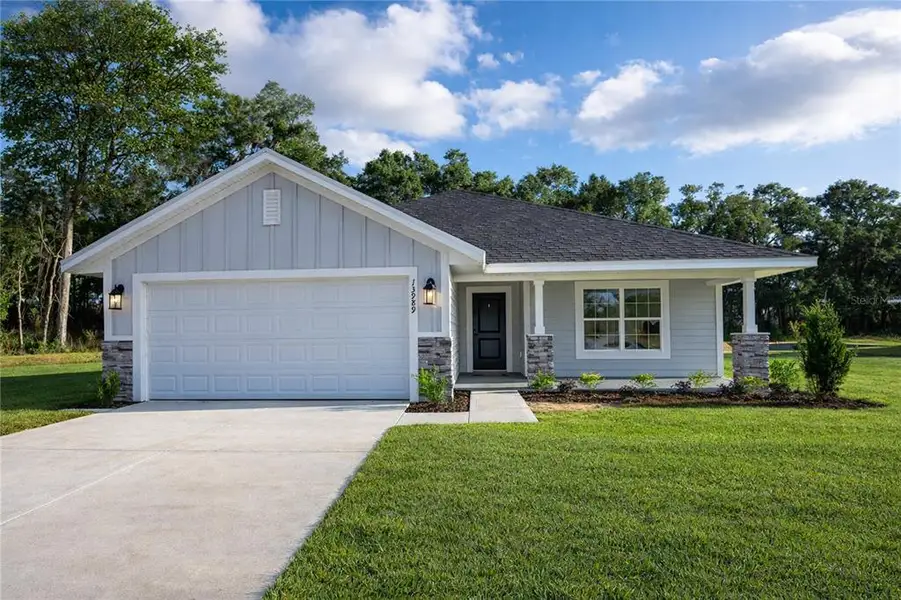 Front exterior of a new home in Briarwood, Alachua, FL, highlighting curb appeal (Image 1). Front exterior of a new home in Briarwood, Alachua, FL, highlighting curb appeal (Image 1).
