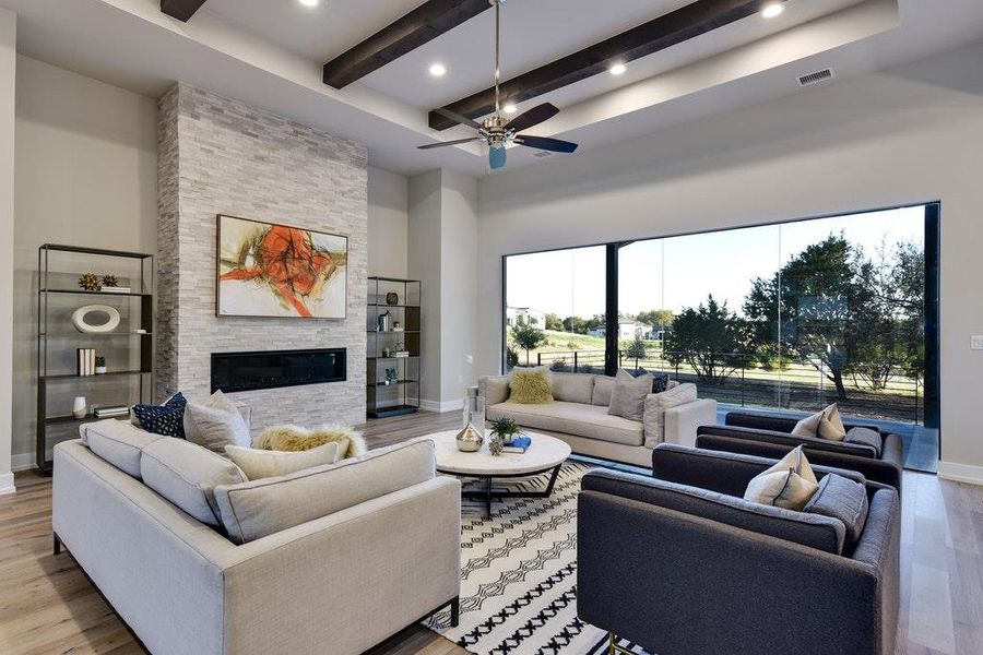 Relax in the great room with high ceilings and natural light Relax in the great room with high ceilings and natural light