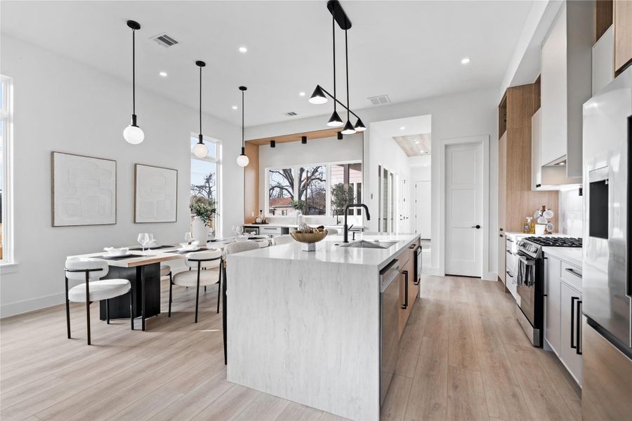 Generous windows are thoughtfully positioned to draw in natural light from every angle, energizing the heart of the home. The result is a space designed not just to be seen, but truly lived in.