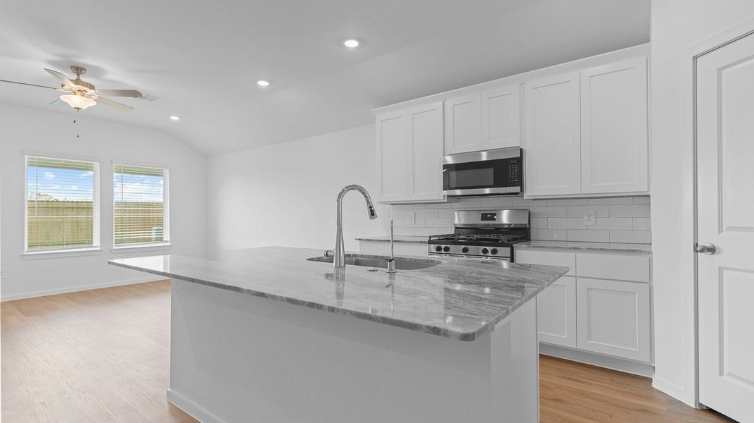 Furnished interior view inside a new home in Caldwell Crossing, Iowa Colony (Image 4).