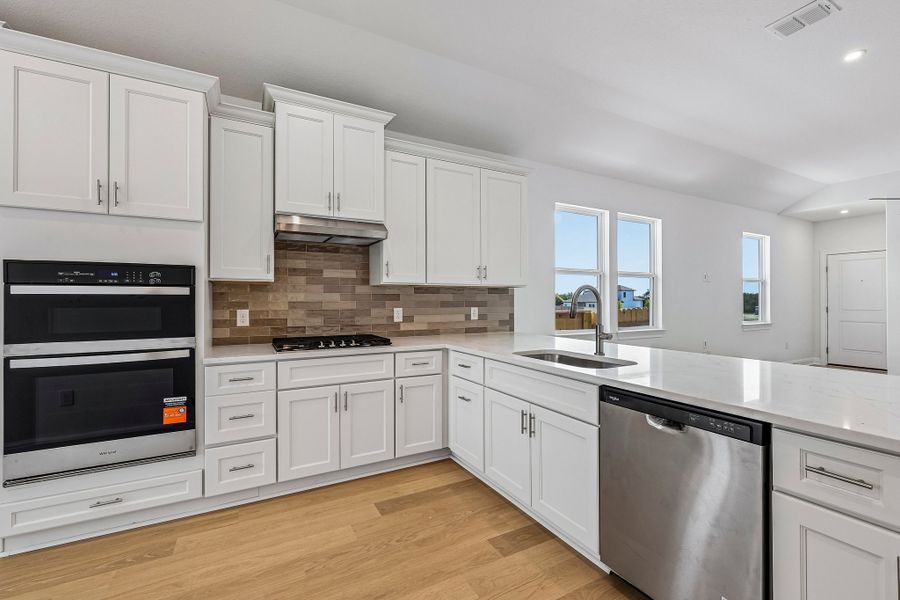 Furnished interior view inside a new home in Sage Hollow, Kyle (Image 6).