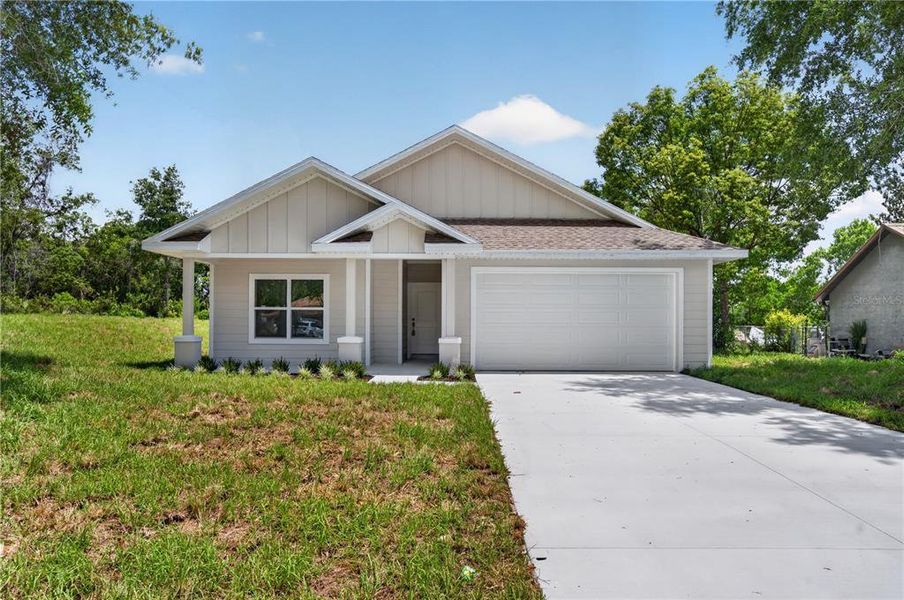 Front exterior of a new home in , Deltona, FL, highlighting curb appeal (Image 1). Front exterior of a new home in , Deltona, FL, highlighting curb appeal (Image 1).
