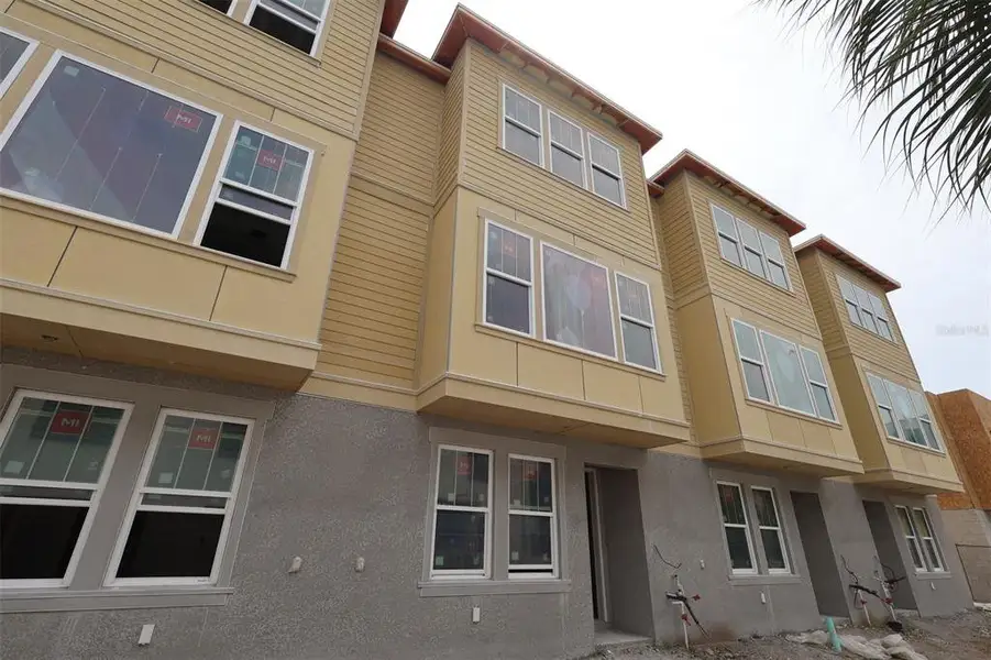 In-progress construction of a new home in Towns at Union, St. Petersburg, FL (Image 12).