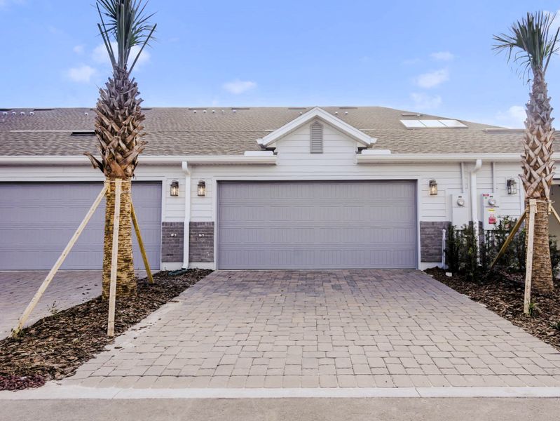 Front exterior of a new home in Aulin Square, Oviedo, FL, highlighting curb appeal (Image 2). Front exterior of a new home in Aulin Square, Oviedo, FL, highlighting curb appeal (Image 2).
