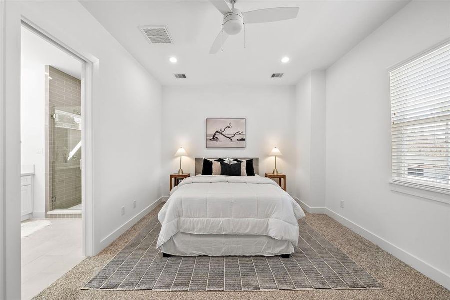 Primary bedroom view with window and bathroom entry!