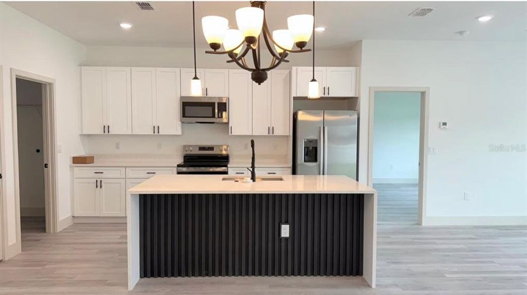 Furnished interior view inside a new home in , Indian Lake Estates (Image 6).