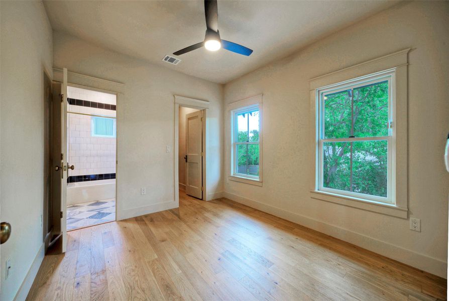 Bedroom #2 features hardwood floors and generous windows creating a light-filled and comfortable bedroom retreat.