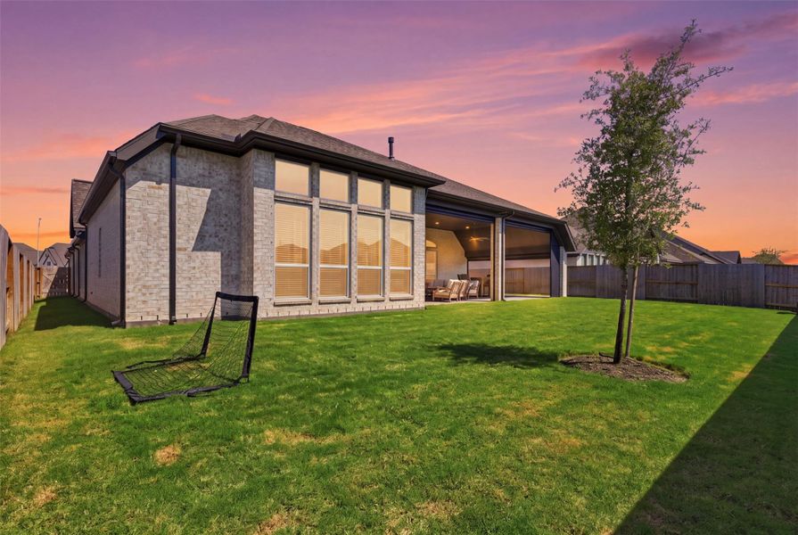 Expansive backyard and upgraded oversizedcovered outdoor patio with motorizedretractable screens. Expansive backyard and upgraded oversizedcovered outdoor patio with motorizedretractable screens.