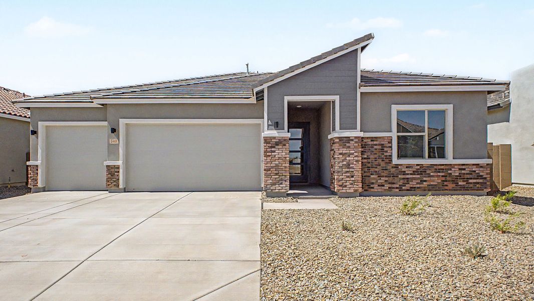 Front exterior of a new home in Landmarke, San Tan Valley, AZ, highlighting curb appeal (Image 1). Front exterior of a new home in Landmarke, San Tan Valley, AZ, highlighting curb appeal (Image 1).