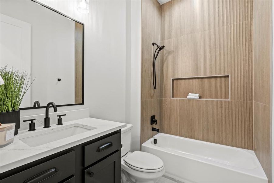 Bathroom featuring vanity and bathtub / shower combination