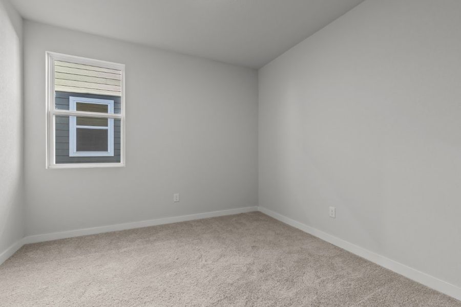 A room with a window and a carpet. A room with a window and a carpet.