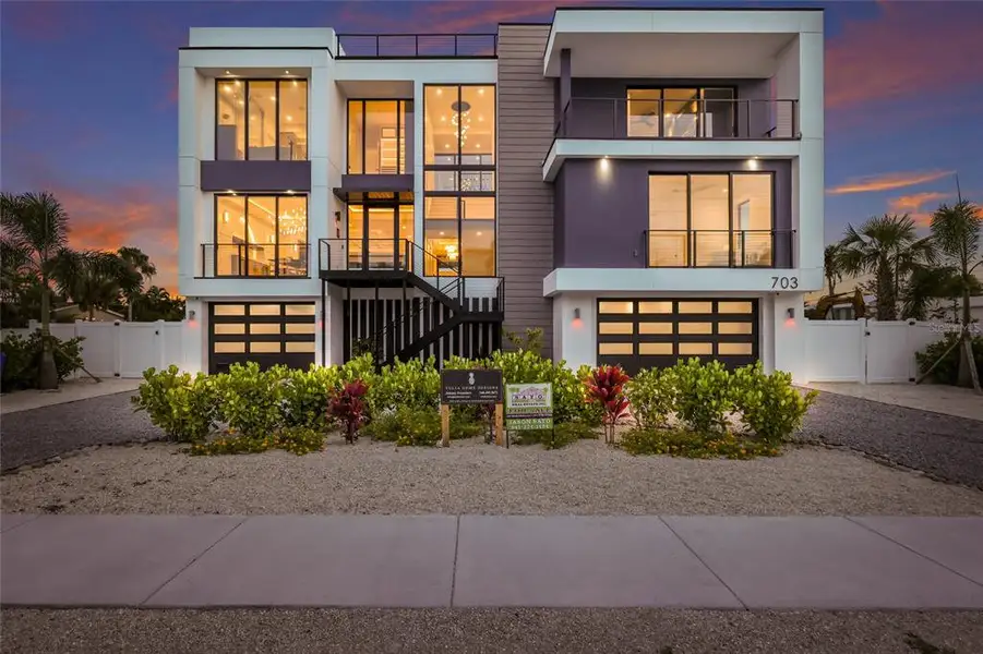 Front exterior of a new home in , Anna Maria, FL, highlighting curb appeal (Image 1). Front exterior of a new home in , Anna Maria, FL, highlighting curb appeal (Image 1).