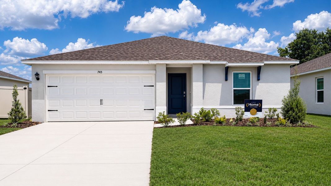 Front exterior of a new home in Leoma's Landing, Lake Wales, FL, highlighting curb appeal (Image 1). Front exterior of a new home in Leoma's Landing, Lake Wales, FL, highlighting curb appeal (Image 1).