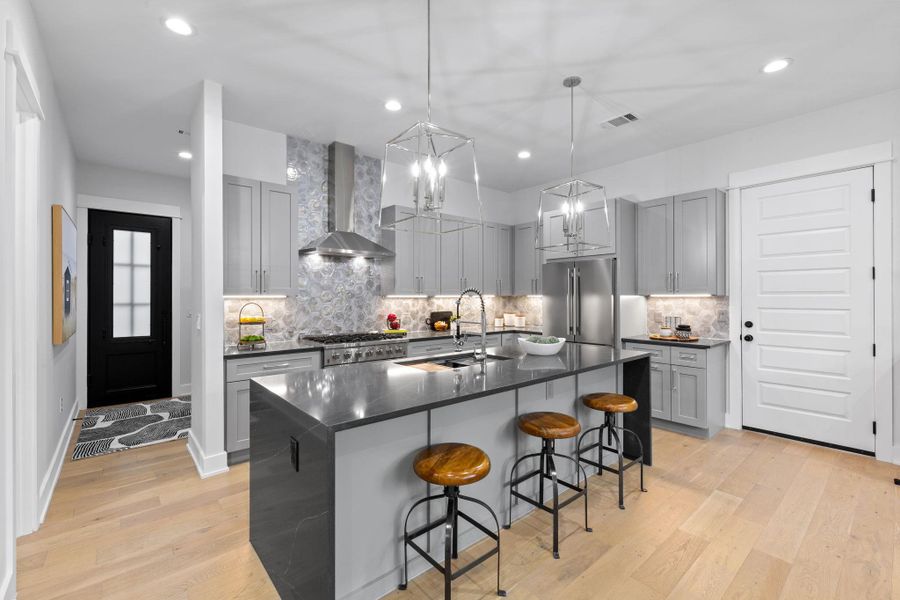 Kitchen with gas cooking, dark countertops, high end appliances - a true chef's dream! Kitchen with gas cooking, dark countertops, high end appliances - a true chef's dream!