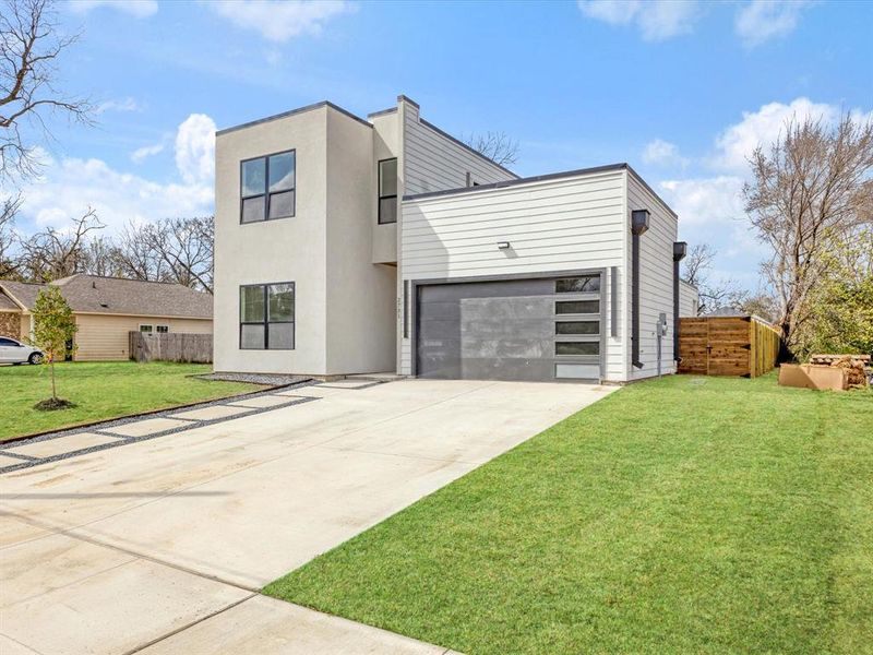 Front exterior of a new home in , Dallas, TX, highlighting curb appeal (Image 21).