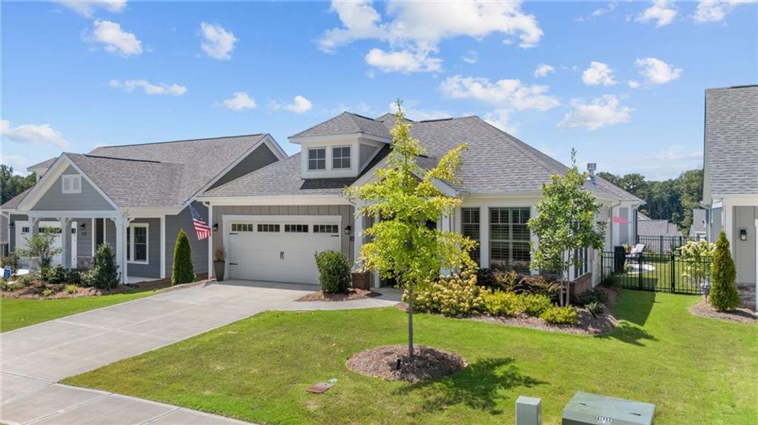 Front exterior of a new home in The Courtyards at Bailey Farms, Dacula, GA, highlighting curb appeal (Image 23).