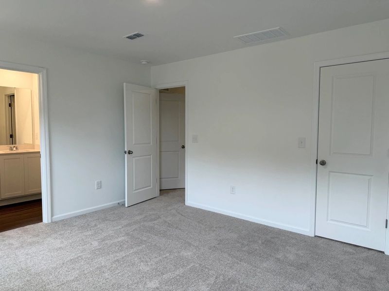 Primary Bed - A sophisticated retreat with style.