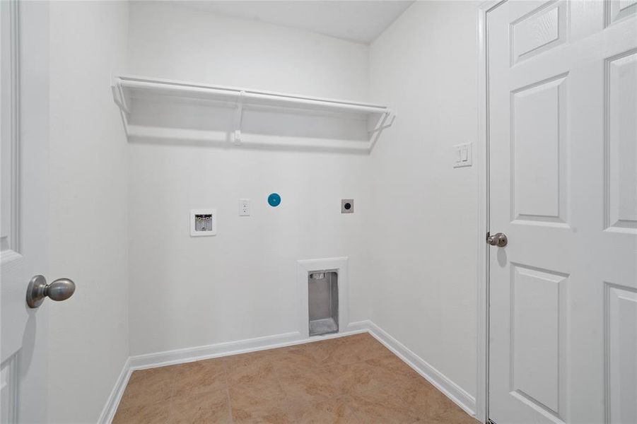 Utility Room spacious for your washer & dryer appliances as well as a high shelf for storage.