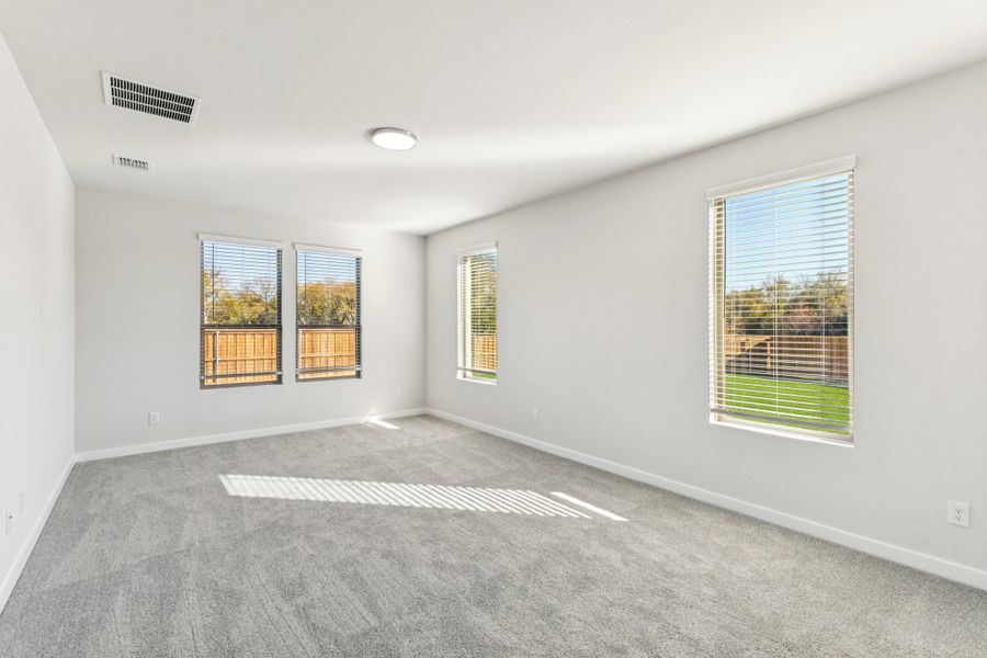 Primary Suite in the Wimbledon home plan by Trophy Signature Homes – REPRESENTATIVE PHOTO