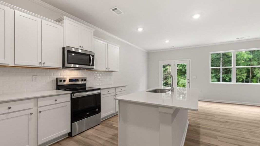 Furnished interior view inside a new home in Waypoint, Flowery Branch (Image 5).