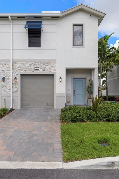 Front exterior of a new home in , Pompano Beach, FL, highlighting curb appeal (Image 20). Front exterior of a new home in , Pompano Beach, FL, highlighting curb appeal (Image 20).