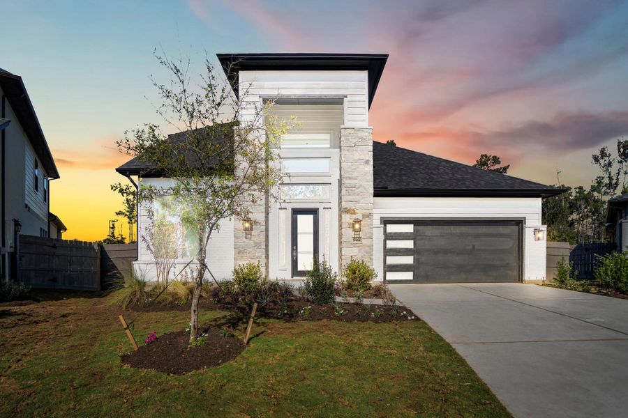Front exterior of a new home in Artavia, Conroe, TX, highlighting curb appeal (Image 27). Front exterior of a new home in Artavia, Conroe, TX, highlighting curb appeal (Image 27).
