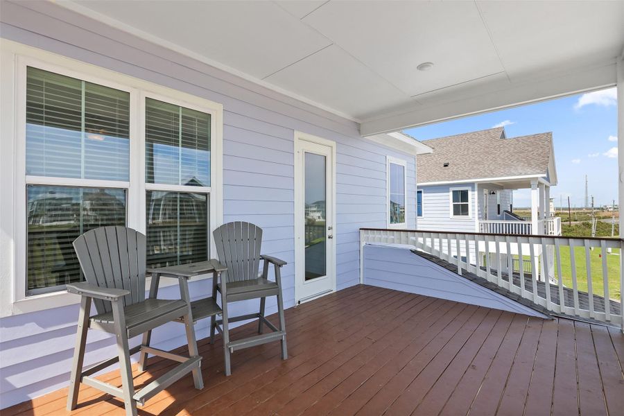 Another angle of the third covered balcony shows just how much shaded space is available, perfect for gathering, lounging, or enjoying meals outdoors.