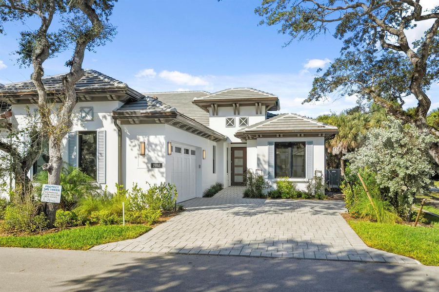 Front exterior of a new home in Seaglass, Wabasso Beach, FL, highlighting curb appeal (Image 29).