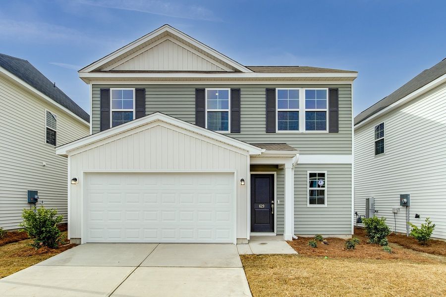 Front exterior of a new home in Winston Point, Gilbert, SC, highlighting curb appeal (Image 1).