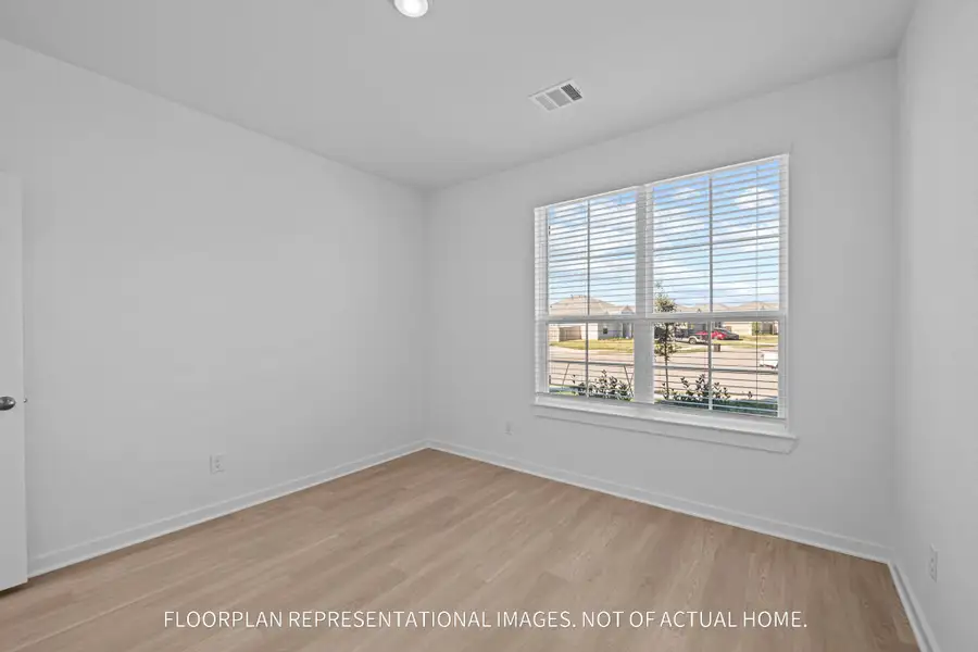 Spacious, unfurnished interior of a new home in The Oaks on 6th Street, Magnolia (Image 8).