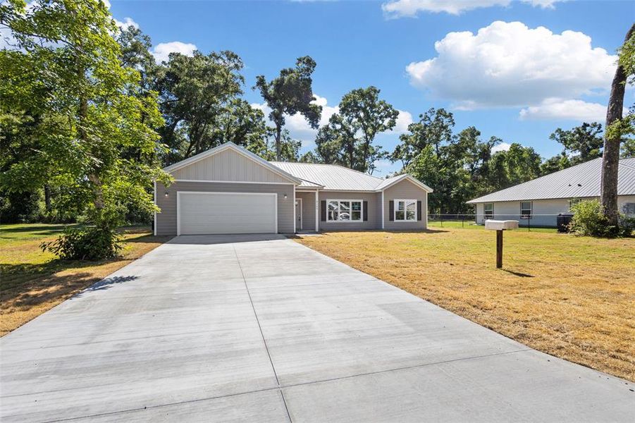 Front exterior of a new home in , Trenton, FL, highlighting curb appeal (Image 28).