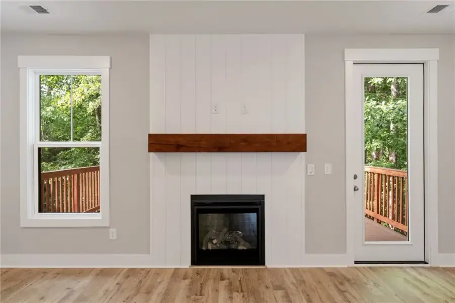 A striking fireplace with a substantial timber man A striking fireplace with a substantial timber man
