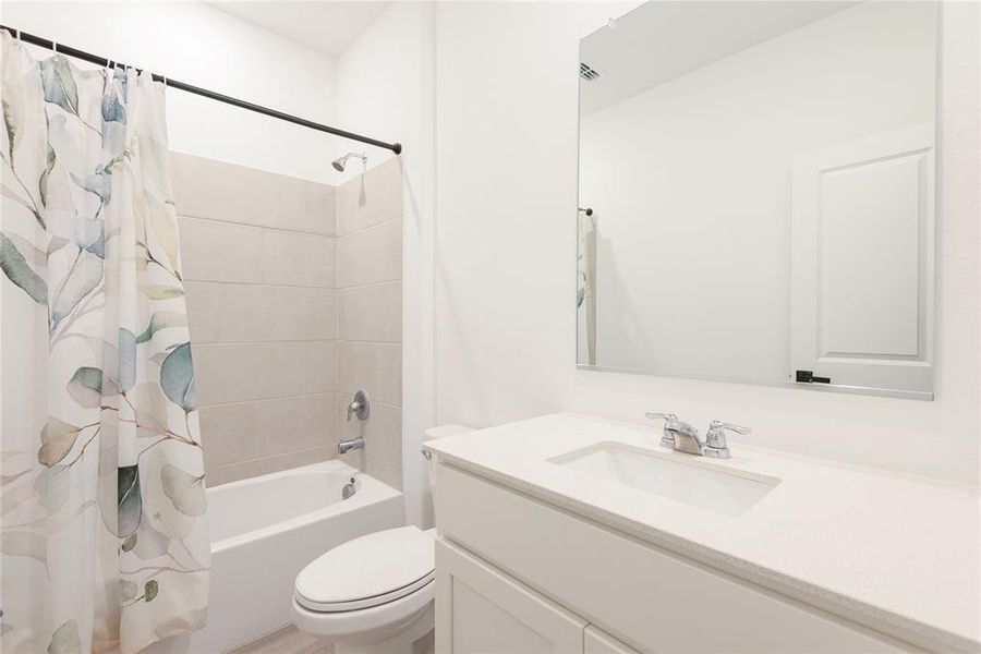 Full bathroom with shower / bath combination with curtain and vanity Full bathroom with shower / bath combination with curtain and vanity