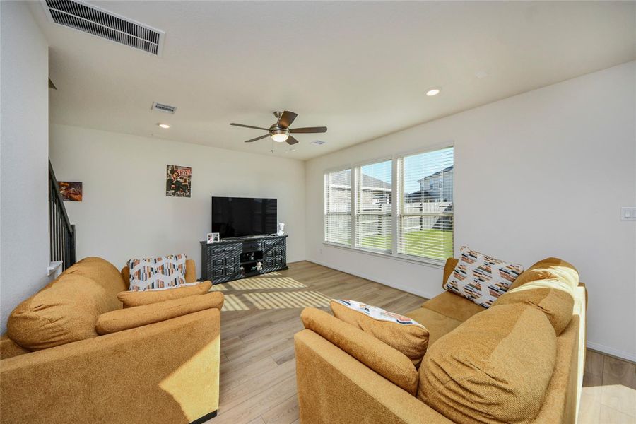 Furnished interior view inside a new home in Sunterra North, Katy (Image 14).